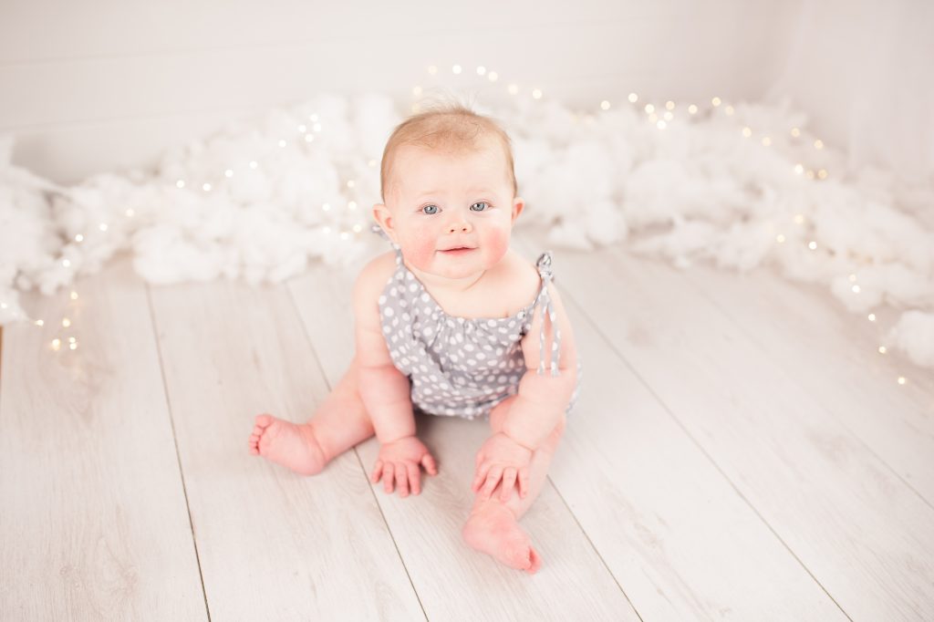 angel, clouds, fairy lights, polka dot romper, blonde baby, rosy cheeks, petts wood, bromley, white