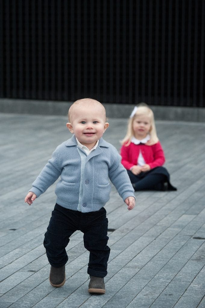 tower bridge, first birthday, siblings, brother and sister, family session, kids pictures, grey, red cardigan, London, city photographer